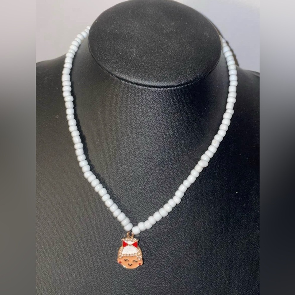 Charming White Beaded Necklace with Gold Pendant